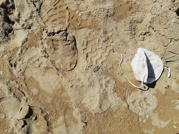 High angle view of broken wall on sand