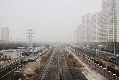 View of railroad tracks in city 