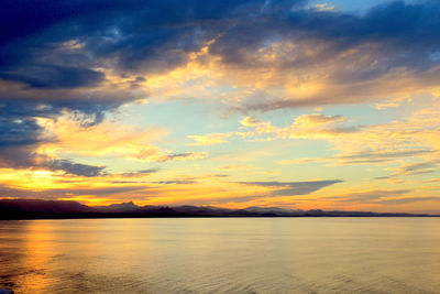 Scenic view of sea against dramatic sky