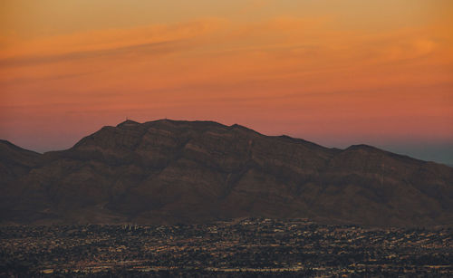 Scenic view of mountains against sky during sunset