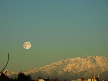 Low angle view of moon against clear sky at night