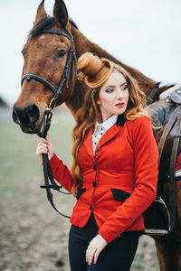 Full length of young woman standing outdoors