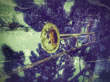 High angle view of rusty bicycle by water