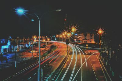 Light trails on railroad tracks at night