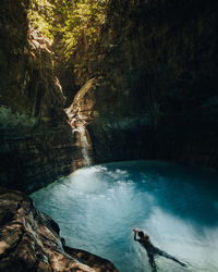 Scenic view of waterfall with blue water