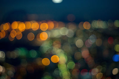 Defocused image of illuminated lights at night