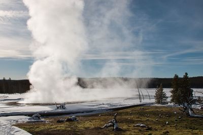 Panoramic view of people on landscape against sky