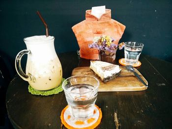 Dressmaker model and food and drinks on table