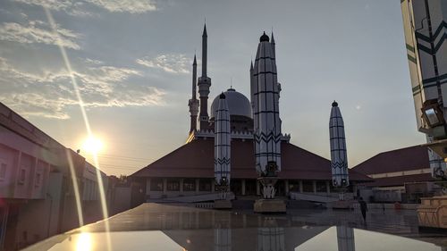 Buildings against sky during sunset