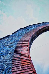 Arch bridge against sky