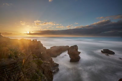 Scenic view of sea against sky during sunset