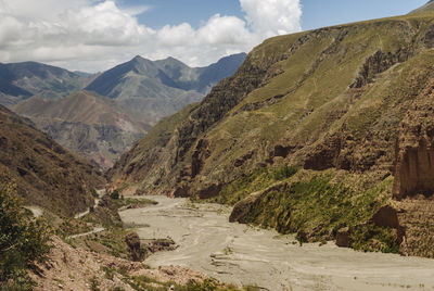 Scenic view of river amidst rocky mountains