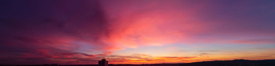 Low angle view of dramatic sky during sunset