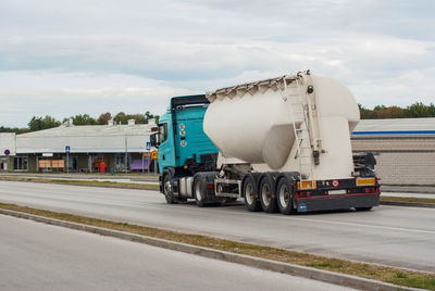 Vehicles on road against sky