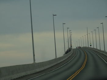 Highway by street against sky- confédération bridge.