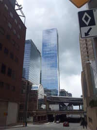 Low angle view of skyscrapers against sky