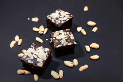 High angle view of chocolate cake on table against black background