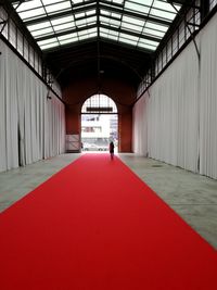 Man walking in corridor of modern building