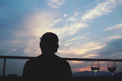 Silhouette of man against sky during sunset