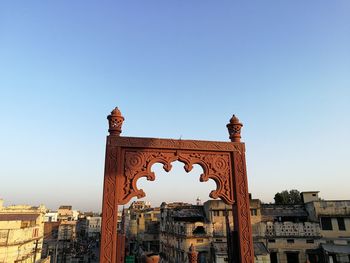 Low angle view of historic building against clear blue sky