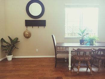 Empty chairs and table in house