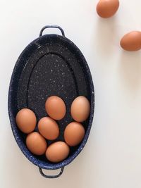 High angle view of eggs in container on table