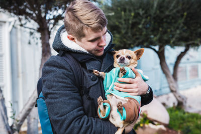 Portrait of man with dog