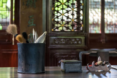 Close-up of paintbrushes indoors