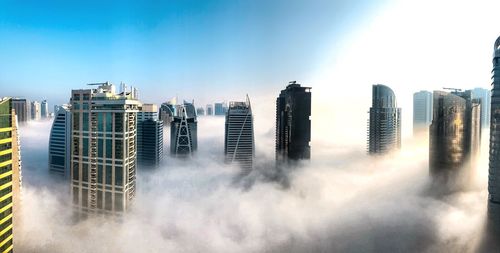 Panoramic view of modern buildings against sky