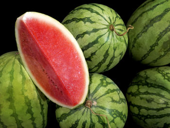 Close-up of strawberry over black background