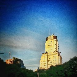 View of buildings against blue sky