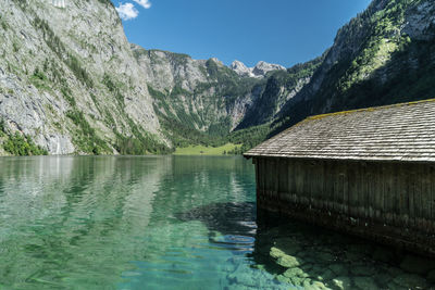 Scenic view of lake and mountains against sky