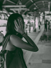 Portrait of young woman standing outdoors