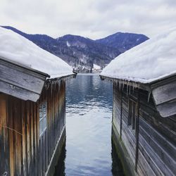 Panoramic view of lake and buildings against sky