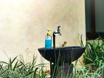 Close-up of faucet in bathroom