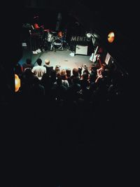 Crowd in illuminated room