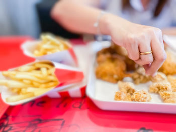 Close-up of person preparing food on table