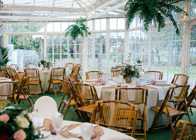 Empty chairs and tables in restaurant