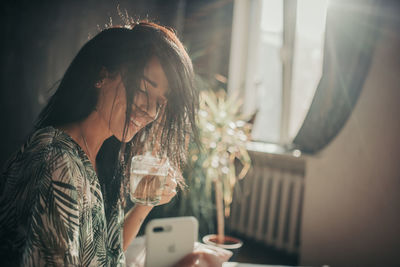 Young woman using mobile phone