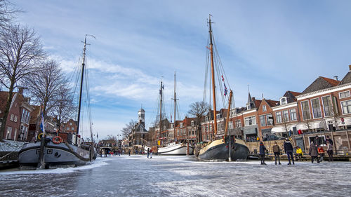Winter fun on the canals in the city dokkum in the netherlands person