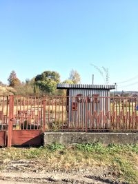 Abandoned built structure on field against clear sky