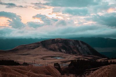 View of mountain range against cloudy sky