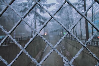 Full frame shot of metal fence during winter