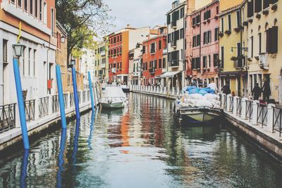 Canal passing through city buildings