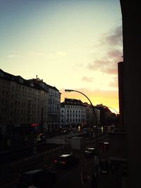 View of city street at sunset