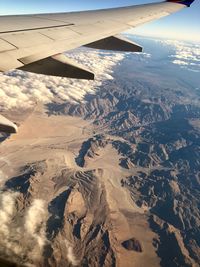 Aerial view of snowcapped mountains against sky