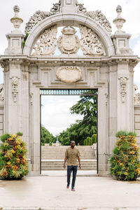 Positive afro american stylish man in european city