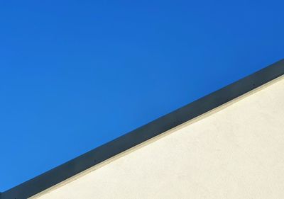 Low angle view of building against blue sky