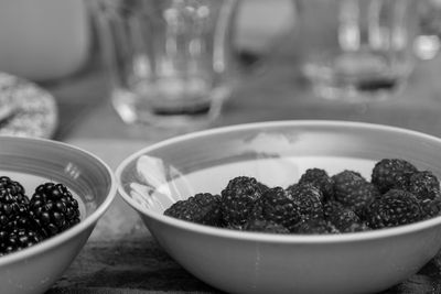 Close-up of fruits in glass bowl on table