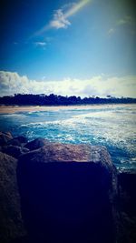 Scenic view of sea against cloudy sky